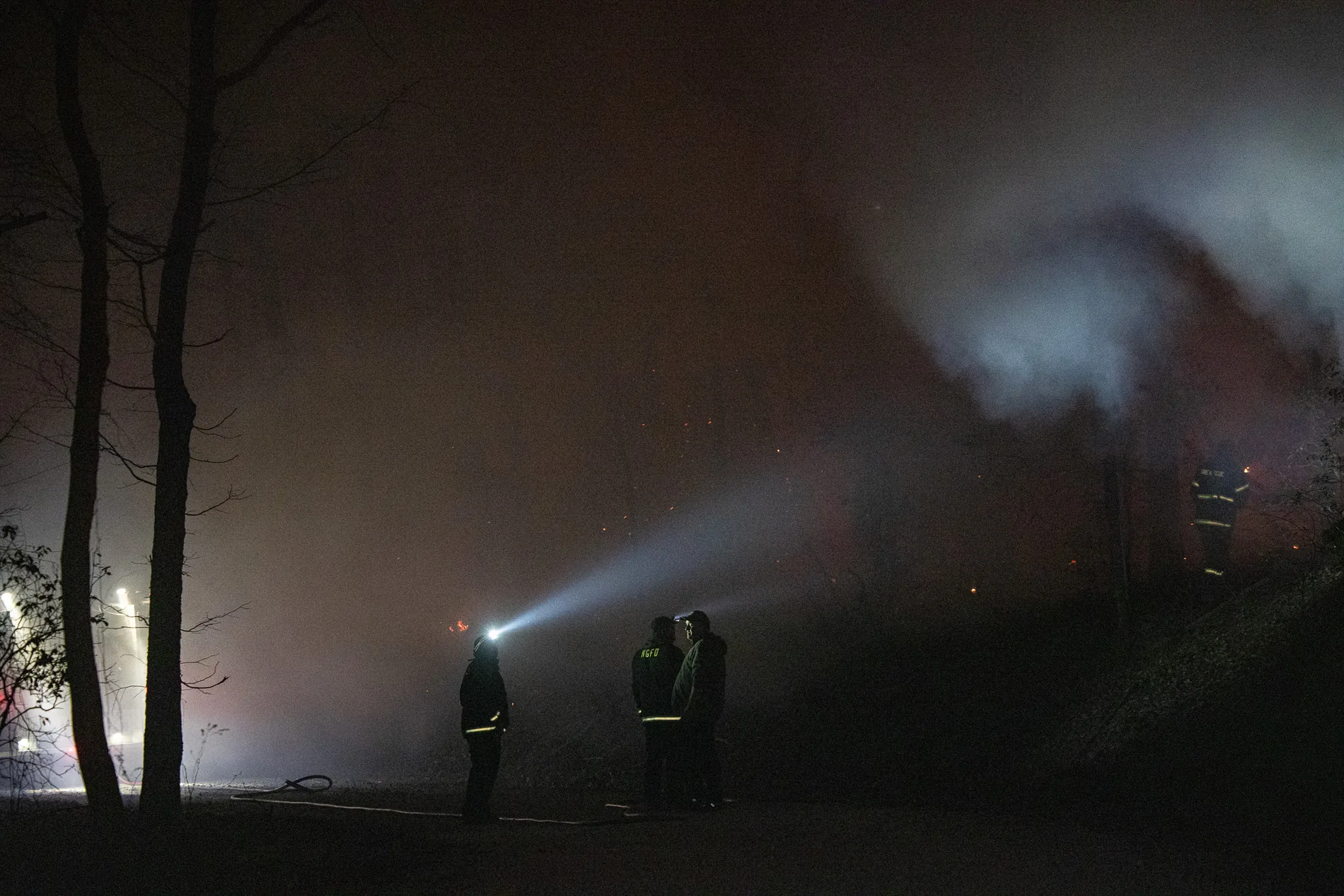 Responders working a scene at dusk