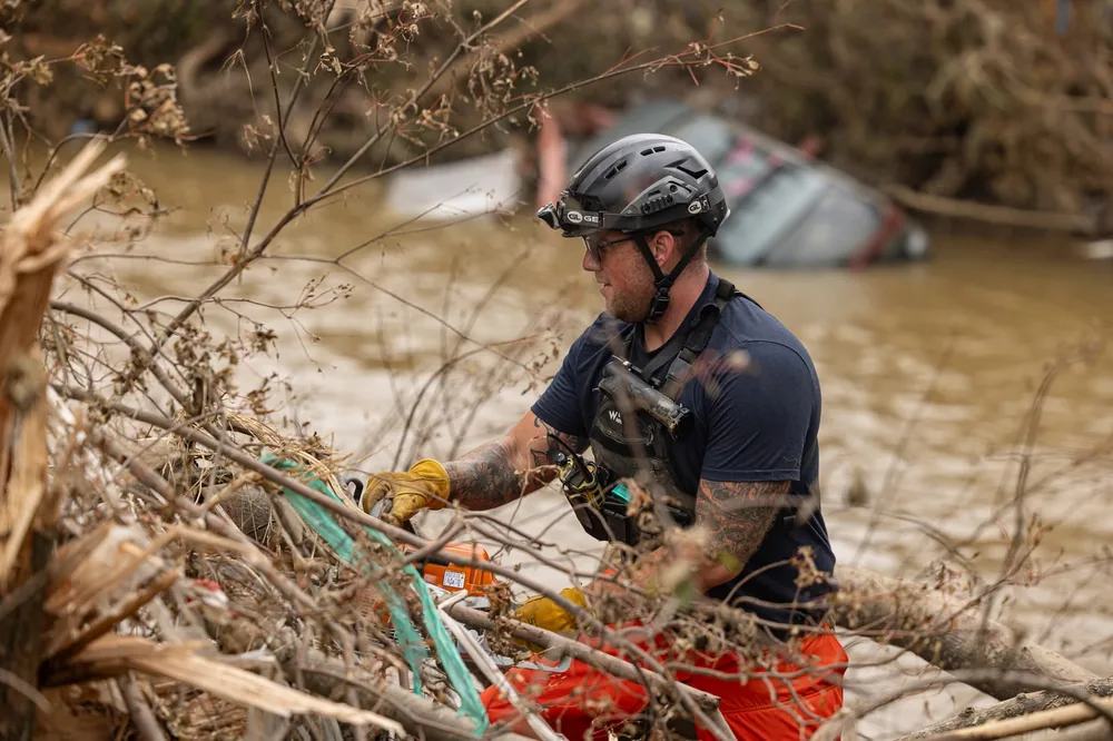 Responder working through debris during search and recover