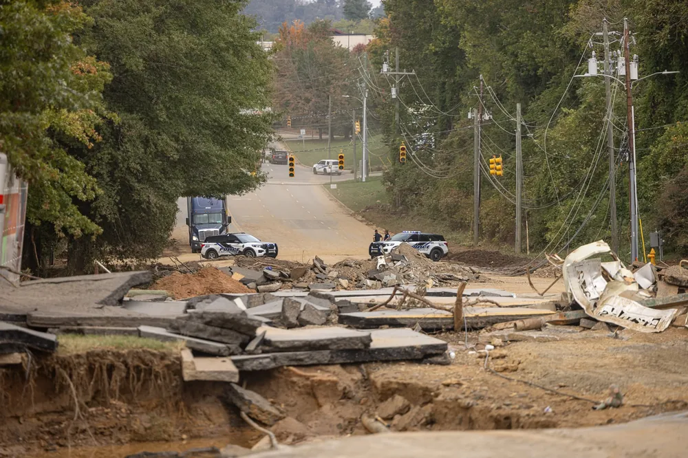Damaged road and structures along the river